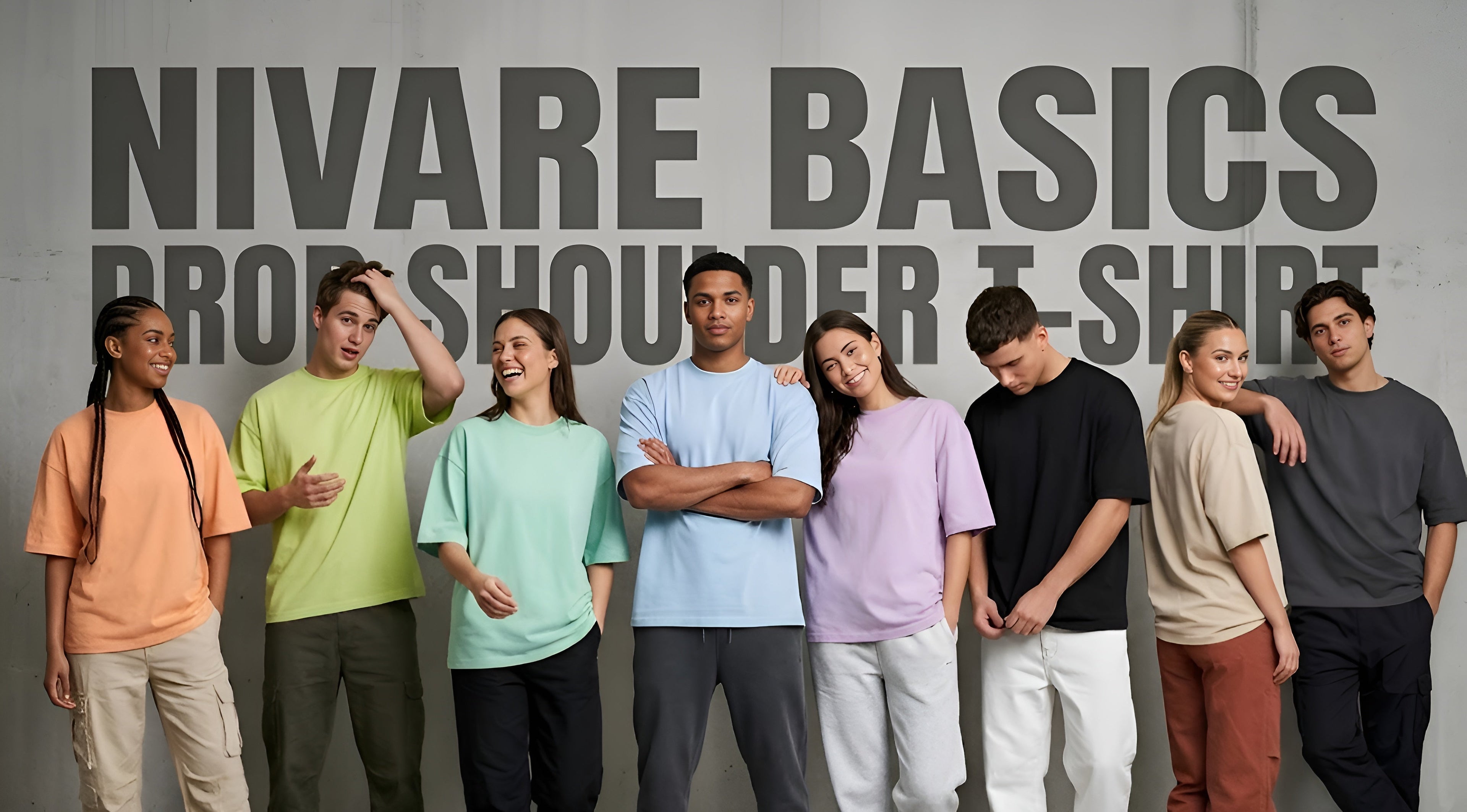 Group of people wearing a 'Nivare Basics Broad Shoulder T-Shirt' with a gray background.