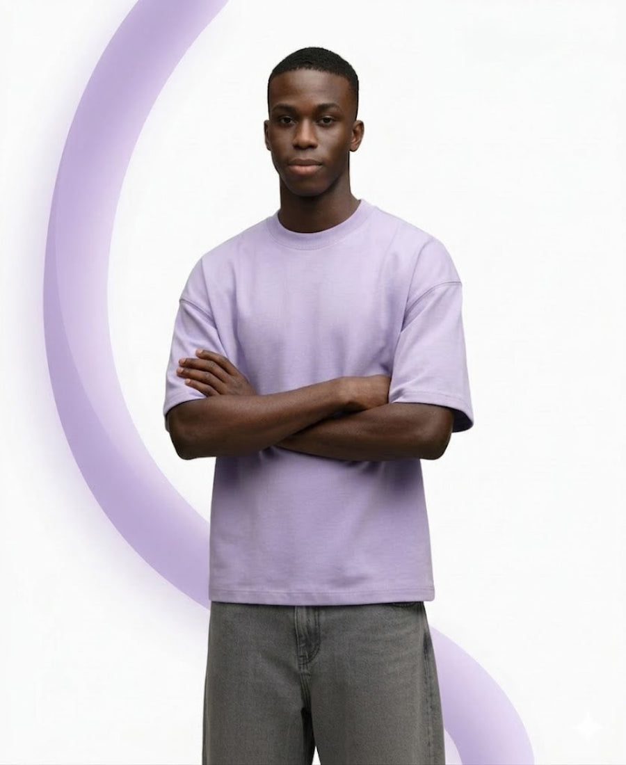 Man wearing a light purple t-shirt with a white background