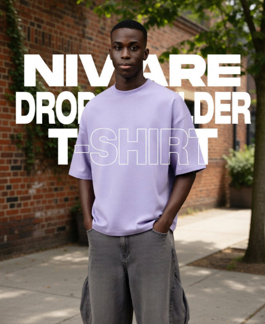 Person wearing a light purple t-shirt with text overlay in an outdoor setting.