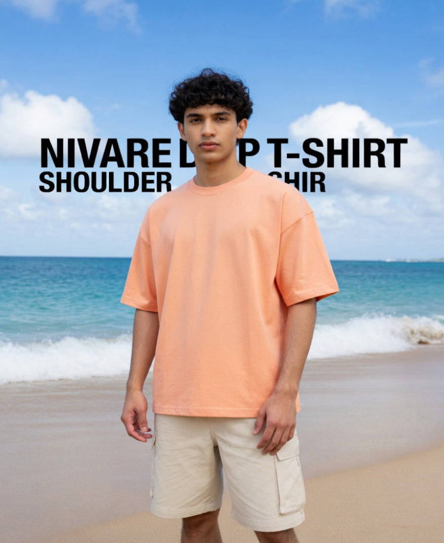 Person wearing an orange t-shirt and beige shorts on a beach with text overlay.