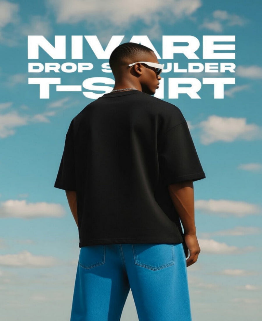 Person wearing a black t-shirt with 'NIVARE' text against a blue sky.